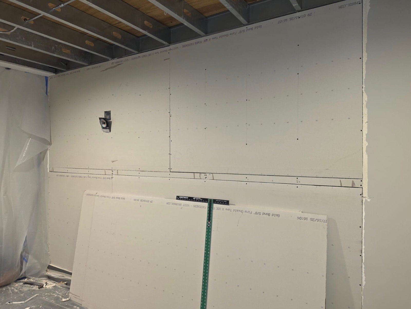 Fire-rated Type X drywall hung on metal stud framing in a commercial space